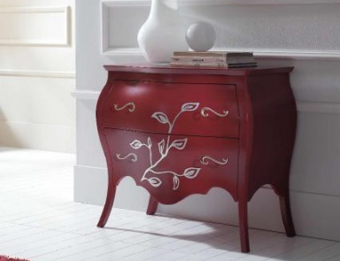 A chest of drawers on high legs, at the stilema stand