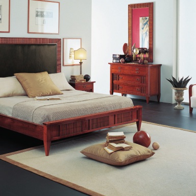 Bed with upholstered headboard