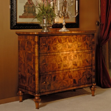 A chest of drawers with inlay