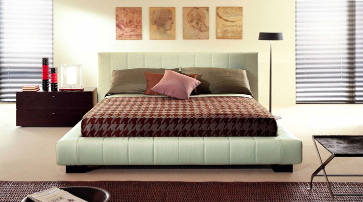 Bed from Nicole Besana with high headboard