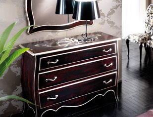 A chest of drawers, decorated with inlay,Tosato