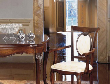 Chair with armrests, at the stilema stand