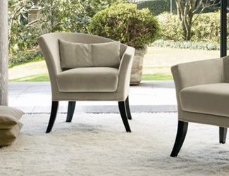 An armchair with asymmetrical backrest, Rosita Swan