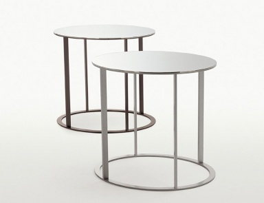 A coffee table on a frame of chrome-plated steel with a table top of glass Elios, B&B Italia