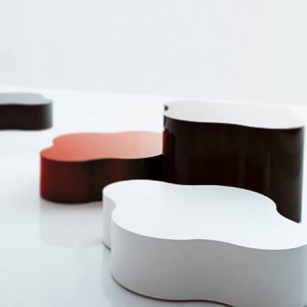 Low tables made of curved multi-layered material , Nuvola - Porro