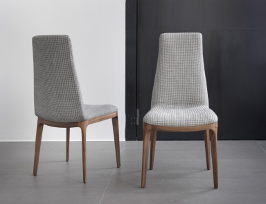 The Eva chair is made of walnut wood with upholstered, Porada