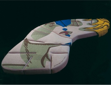 A sofa covered with a cloth Flap, Edra