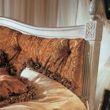 Double bed with upholstered headboard