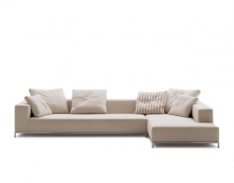 A modular sofa on a frame of steel upholstered in leather or fabric George, B&B Italia S. p.A.