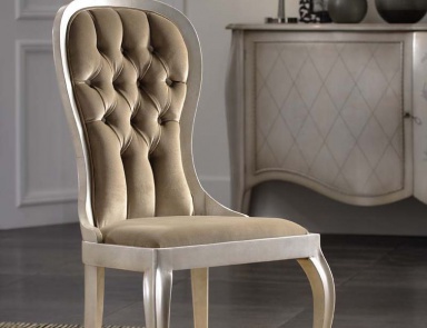 A chair with soft upholstery, PREGNO