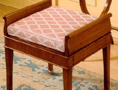 A chair with soft upholstery, PREGNO